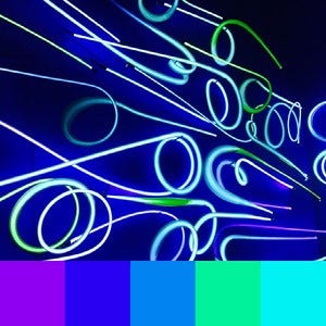 A color palette created from an image of light up neon blue and green lights against a dark blue background