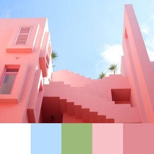 A color palette created from an upward facing image of a pink building against a blue sky with palm trees