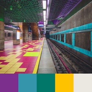 A color palette created from an image of a subway station with pink, yellow, and blue tiles with a green and purple ceiling