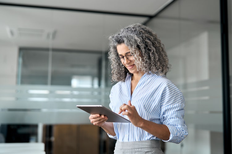 A woman uses SOW software on a tablet