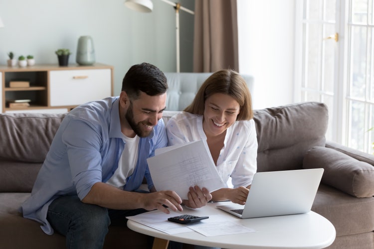 A couple review their donation receipt before submitting online.