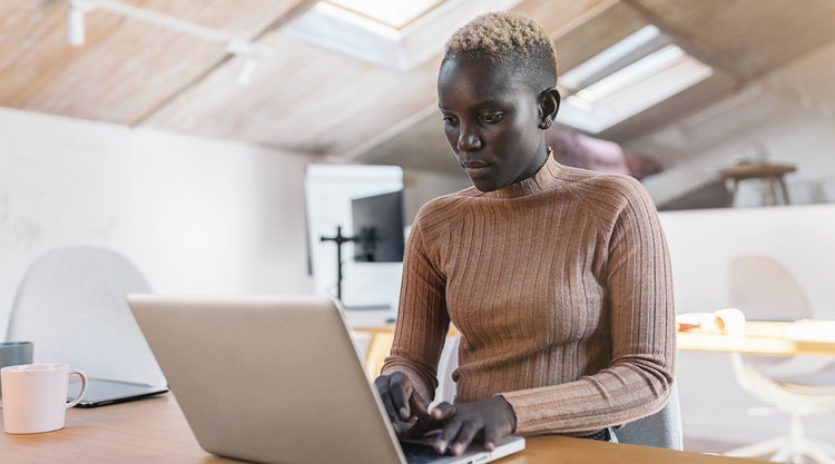 A businessperson works on laying out a document workflow