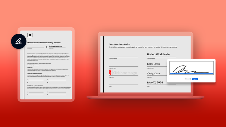 A tablet and laptop both display memorandum of understanding documents.