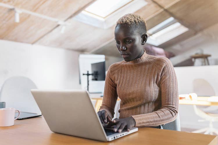 A businessperson works on laying out a document workflow