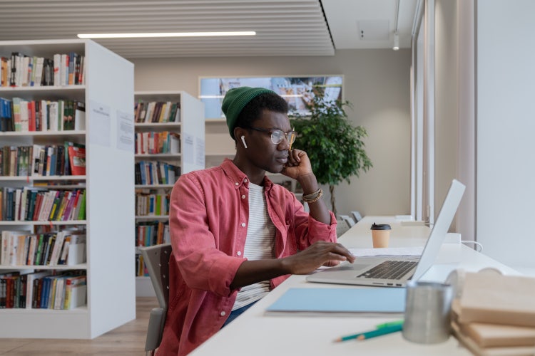 A man uses Adobe Acrobat to send his resume as a PDF.