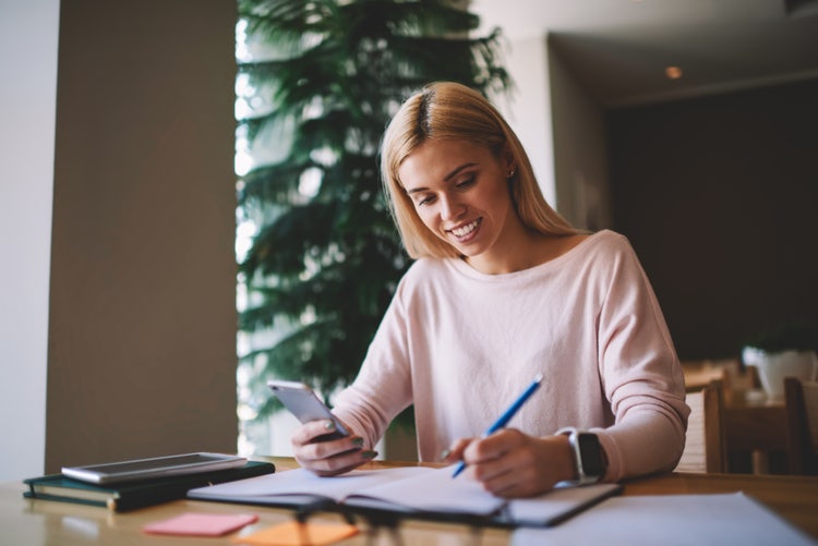 A woman uses time management to-do list tips to accomplish more tasks.