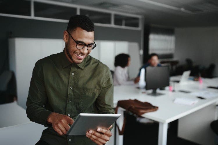 A smiling person converting Excel files to PDFs without losing formatting.