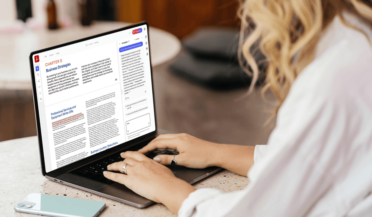 A woman uses a laptop to read info on equipment write-offs.