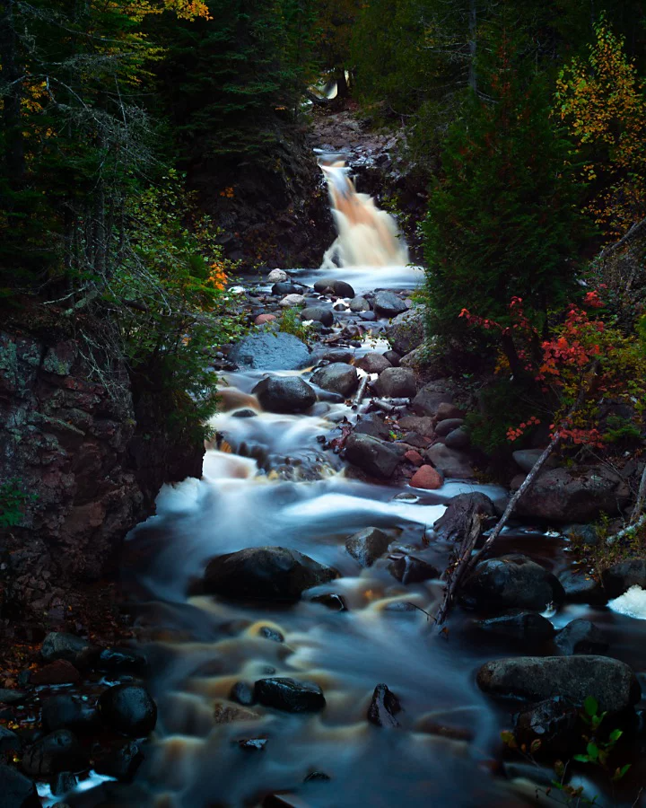 A small waterfall with a flowing stream