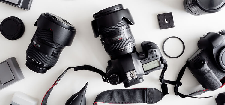 DSLR camera with different camera lenses and other camera accessories