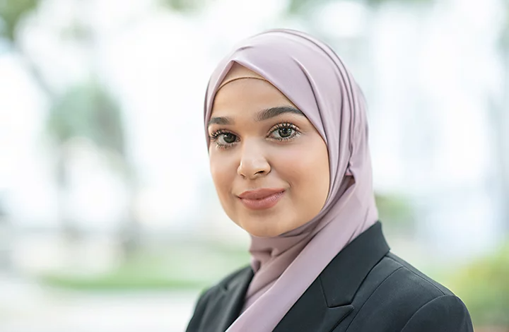 A person posing for a corporate headshot photo