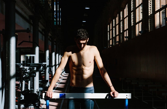 Daylight illuminating a workout room with a person standing in it