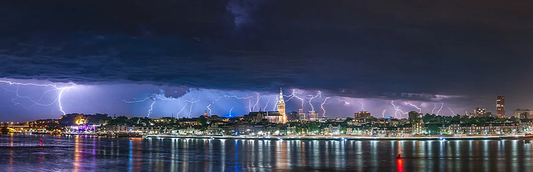 Panoramic storm photo that captures multiple lighting strikes at one time