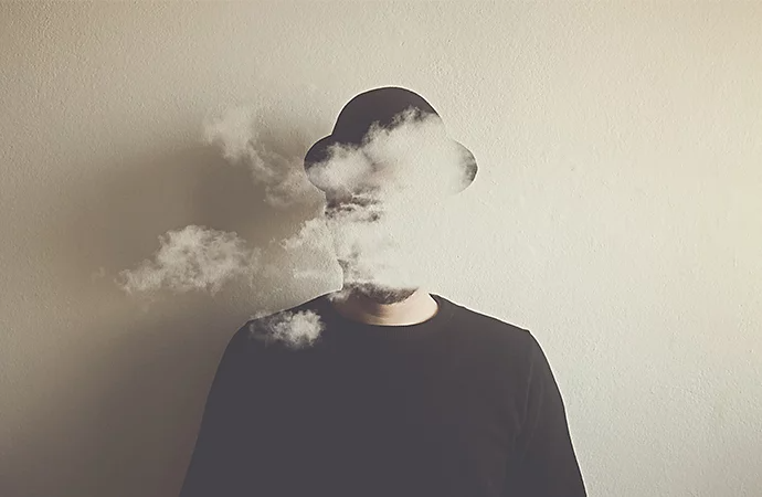 Surreal photo of smoke cloud in front of a person's face