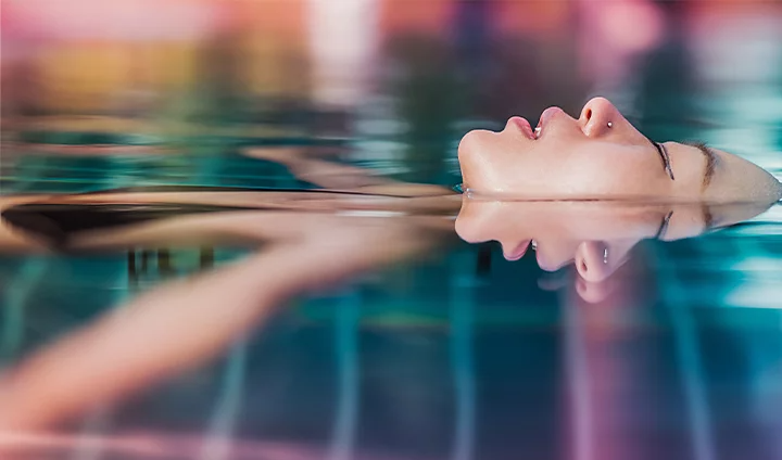 Swimmer floating in pool