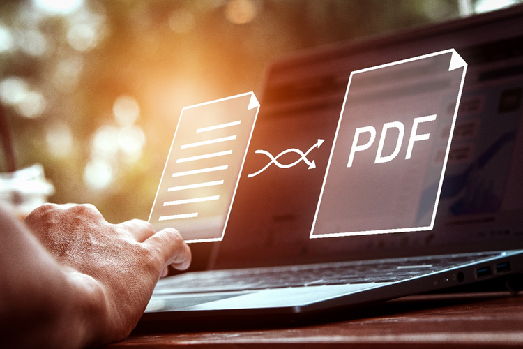 Photo of a person's hands working on a laptop. Overlaid on the screen of the laptop is a diagram depicting converting a document to a PDF online.