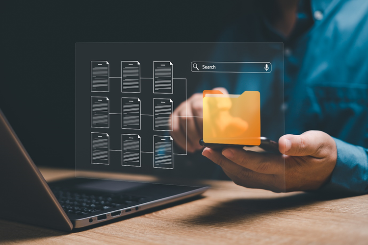 Person using smart phone and laptop, overlaid with a conceptual diagram showing search above a folder with multiple files.