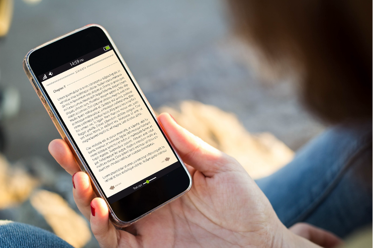 A person reads Chapter 7 of a book on their mobile phone screen.