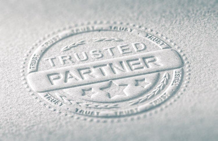 Paper imprint of a trusted partner seal/stamp.