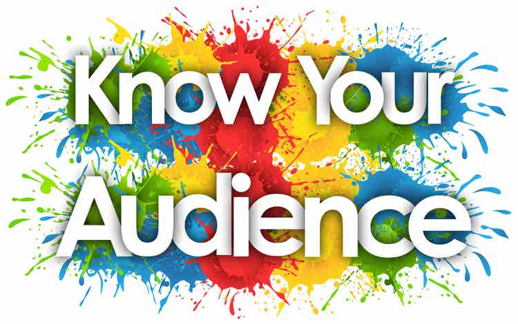 The words "know your audience" over a splash paint background of primary colours.