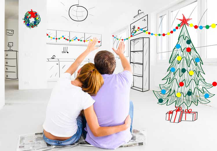 Photo of a young couple sitting on a floor of an empty room overlaid with sketched images of where to place decorations.