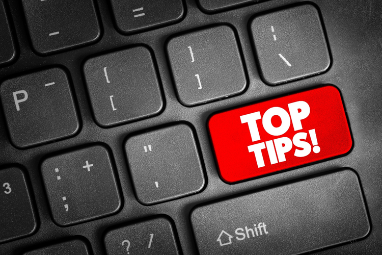 Portion of a keyboard with the enter key replaced with a red and white button with the text, "Top Tips!"