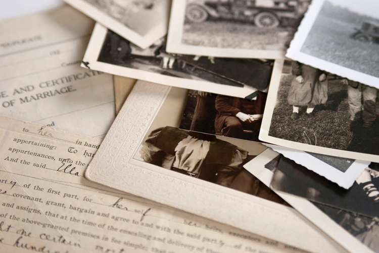 Photo of old documents and photographs that might be used for family history and genealogical research.