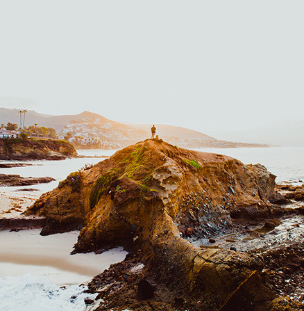 Use landscape photography techniques to take photos of subjects on a distant hilltop