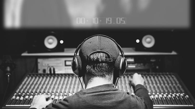 A sound engineer working on a board