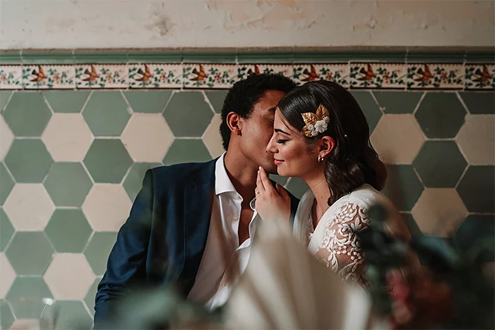 A newlywed couple posing for a wedding photo