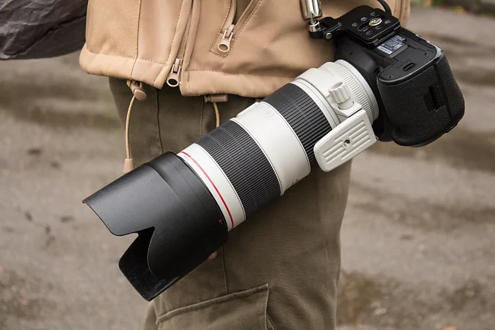 A large telephoto lens attached to a camera