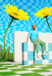 An AI-generated image of giant daisies behind a man sitting on a bench.