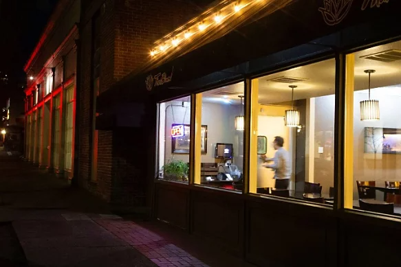 Storefront at night as an example of photojournalism