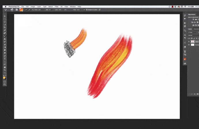 Using a digital pen to paint in a graphics design programme.