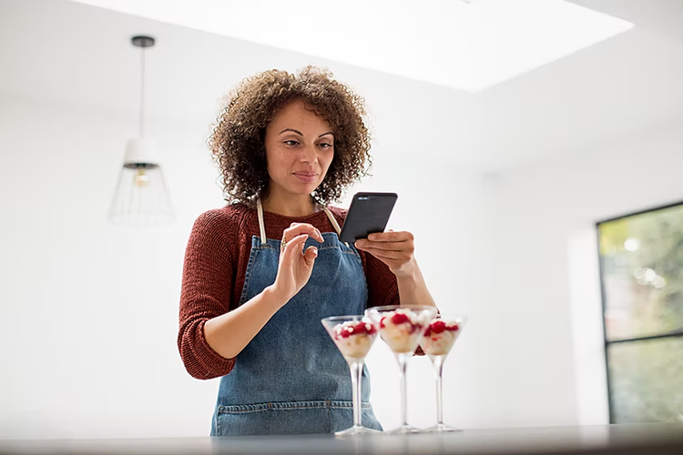 A business owner using their phone to take photos of their product to be used for marketing