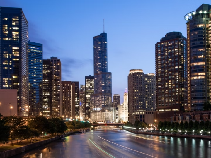 The darkened skyline of a cityscape captured with bright artificial lights dotting it