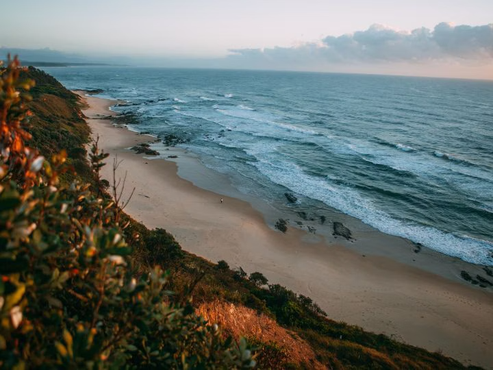 A landscape photo of a beach and the ocean.