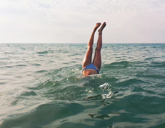 Original, unedited version of the photo with the swimmer diving into the ocean.