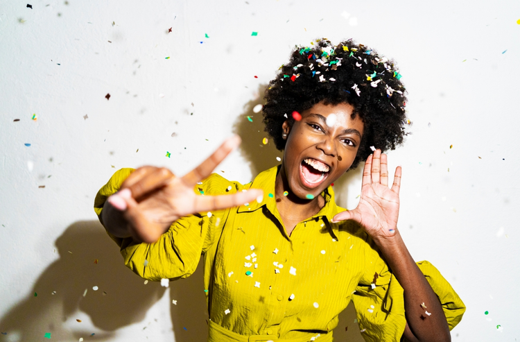 Photo of a person surrounded by confetti and excited to be making a GIF