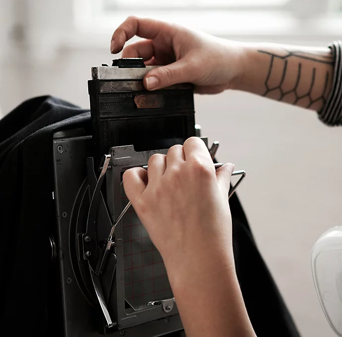 A photographer setting up a tintype camera