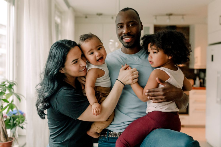 A family photo taken inside a home.