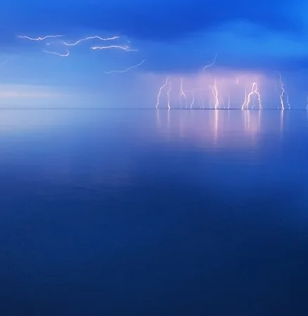 Photograph of a lightning storm far in the distance