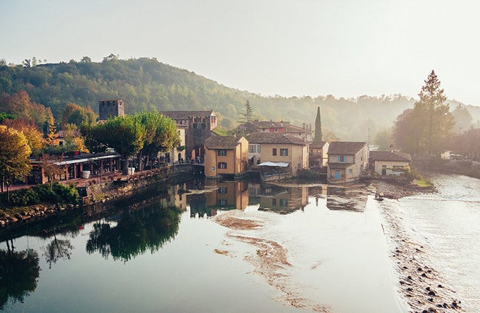 View of a small village from across a small lake.