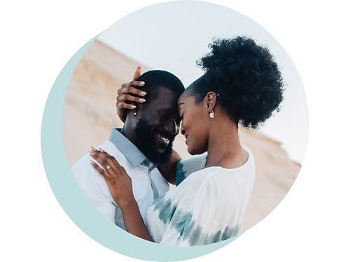 Circular image of two people embracing is framed using a two-shot