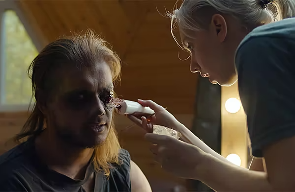 Makeup artist applies special effects eye makeup to a subject