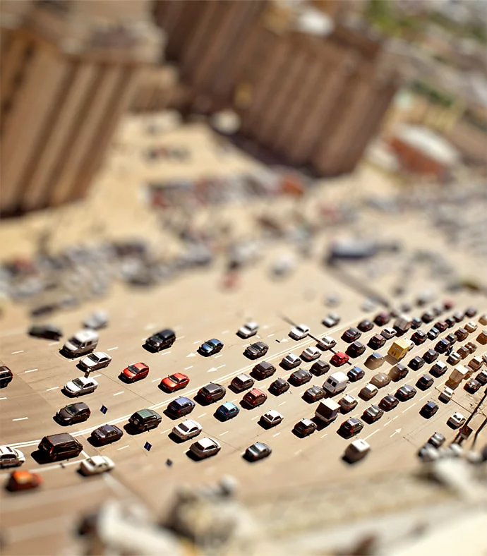 tilt shift photo of a high traffic roadway in a city