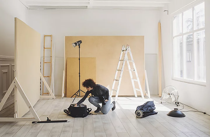 A photographer setting up for a commercial photoshoot