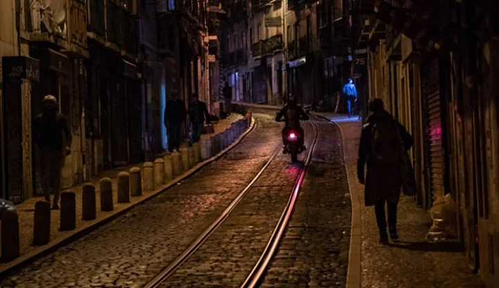 A photo of a city street at night.