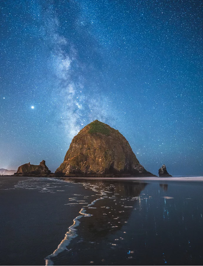 The Milky Way behind Haystack Rock at Cannon Beach