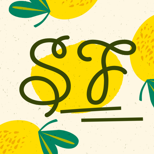 A yellow lemons with green leaves and letters Description automatically generated